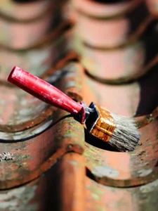 a paint brush on a roof
